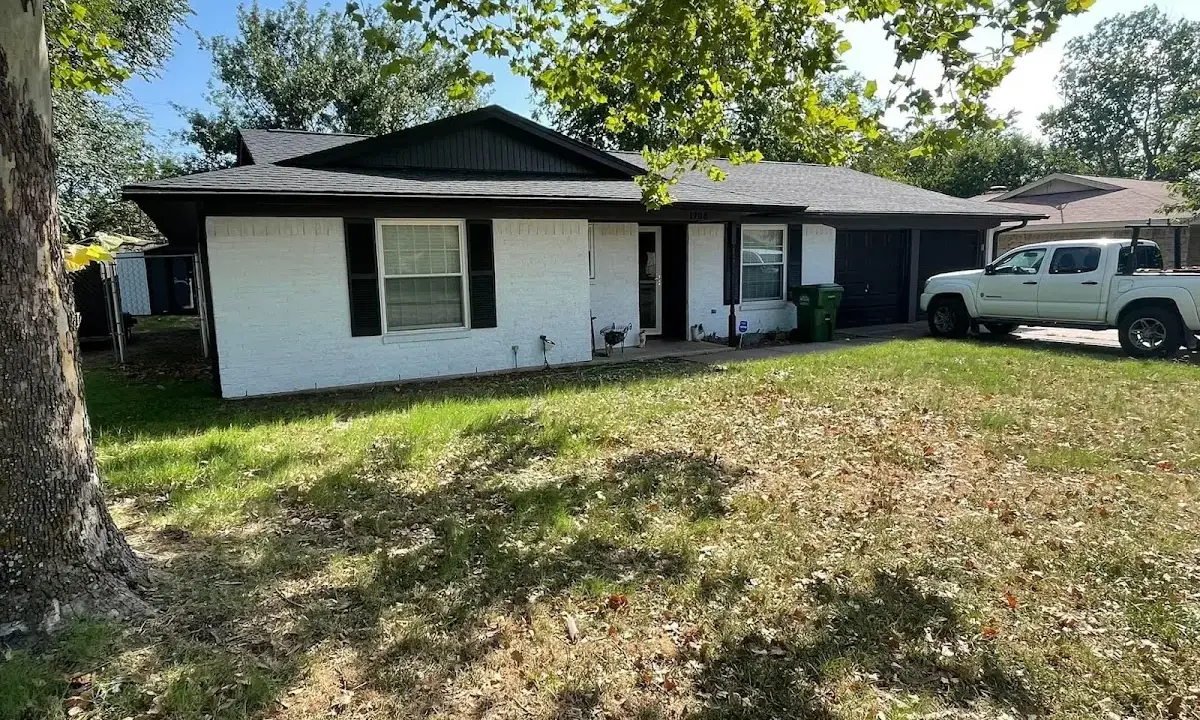 Professional roofing crew working on a residential roof in Cedar Hill